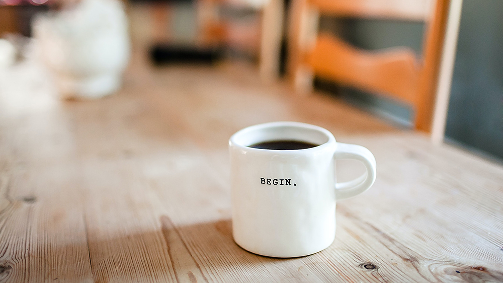 Coffee mug that says Begin