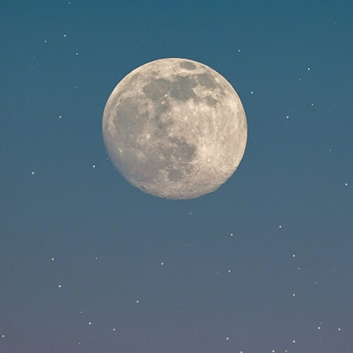 Full moon in a star-lit sky