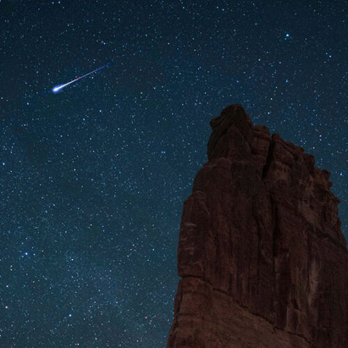 Starry night sky and shooting star